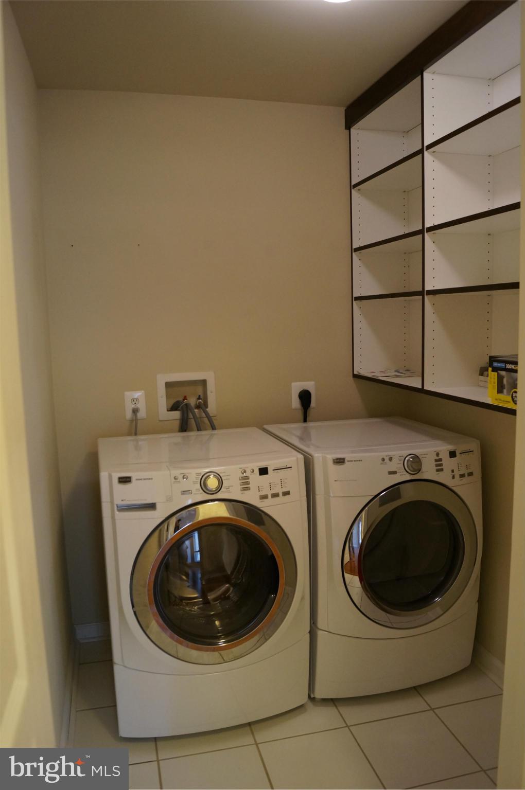 12000 Market Street, Unit 425 Reston, VA 20190 - Photo 19 of 30 a utility room with dryer and washer