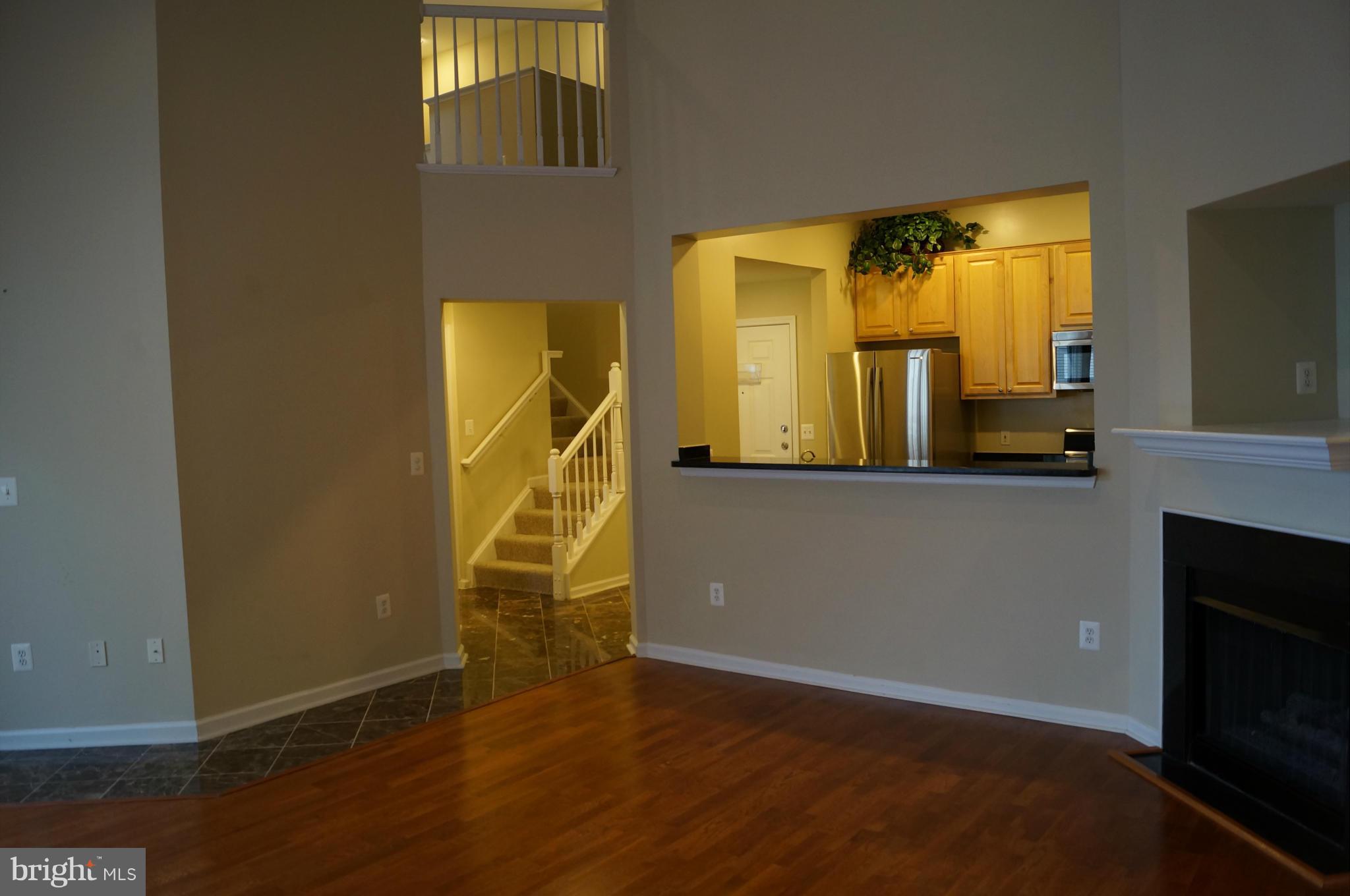 12000 Market Street, Unit 425 Reston, VA 20190 - Photo 20 of 30 a view of a living room with a mirror