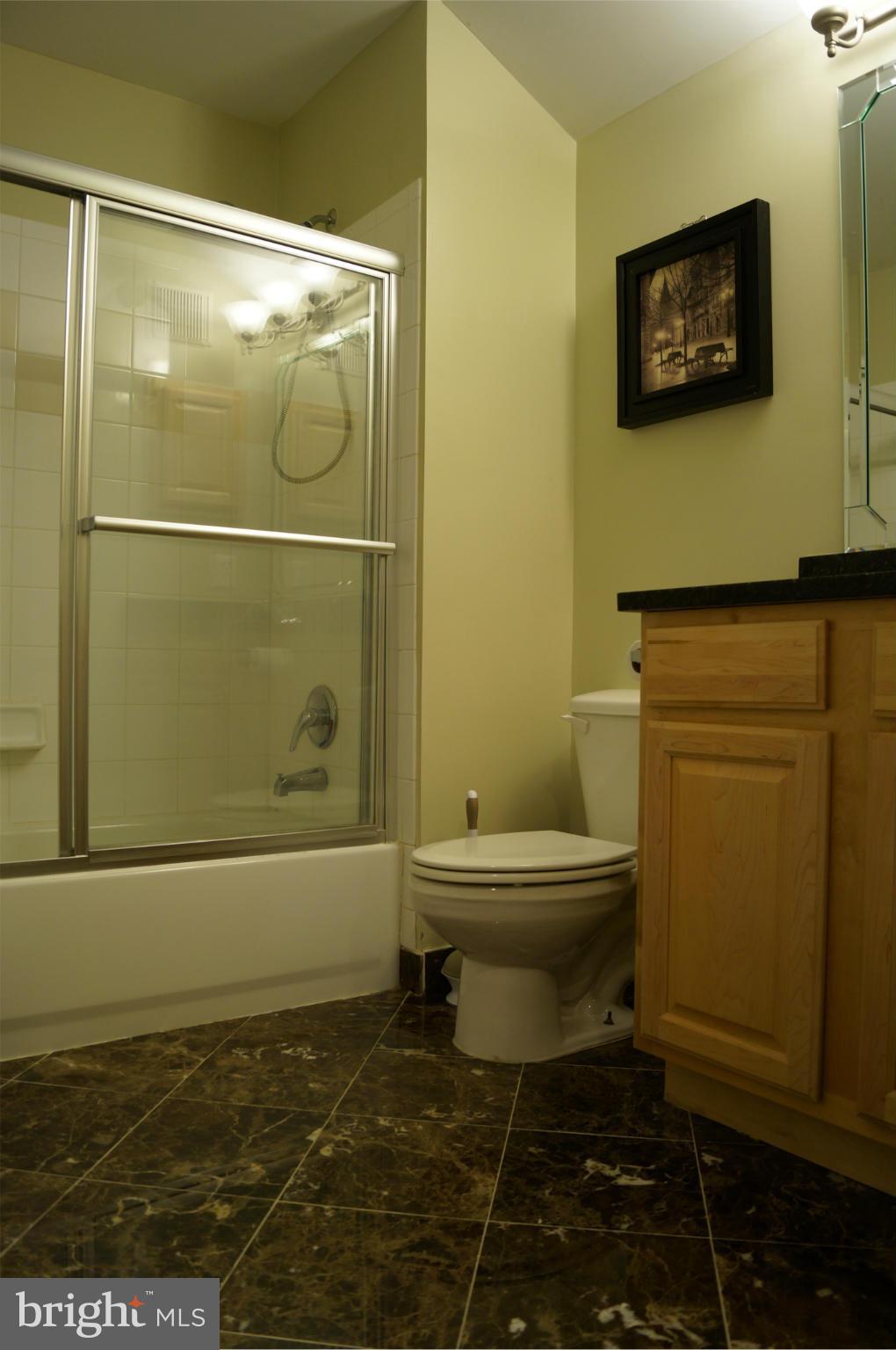12000 Market Street, Unit 425 Reston, VA 20190 - Photo 25 of 30 a bathroom with a toilet and a shower