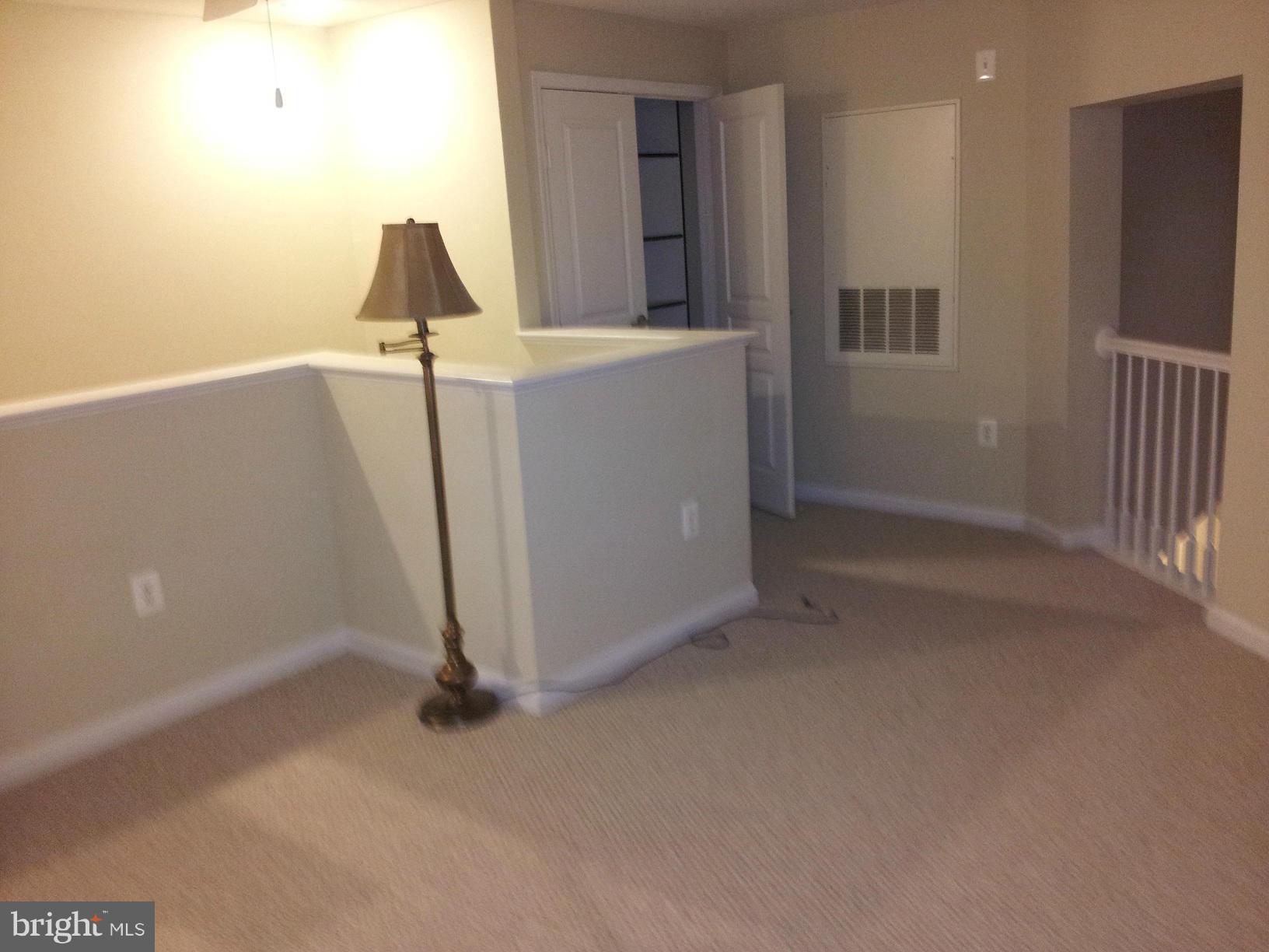 12000 Market Street, Unit 425 Reston, VA 20190 - Photo 4 of 30 a view of a room with utility room