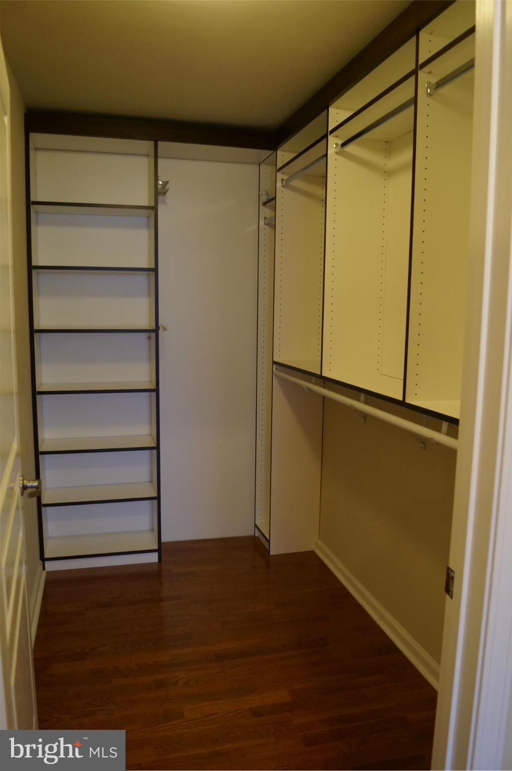 12000 Market Street, Unit 425 Reston, VA 20190 - Photo 9 of 30 a view of walk in closet with empty racks