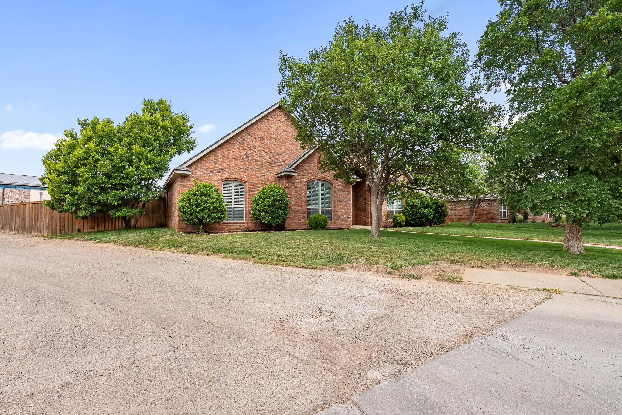 5008 Wesley Road Amarillo, TX 79119 - Photo 2 of 47 a view of house with yard and green space