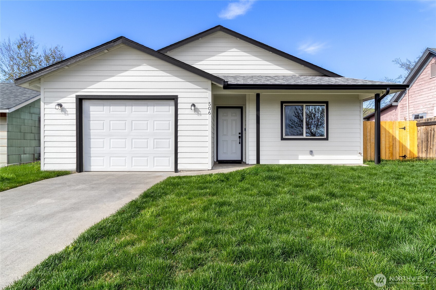 506 Edith Avenue Walla Walla, WA 99362 - Photo 1 of 18 a front view of a house with a yard and garage