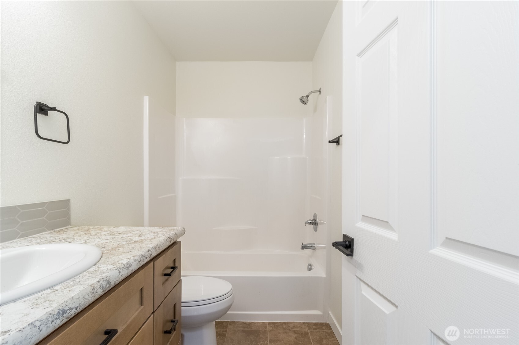 506 Edith Avenue Walla Walla, WA 99362 - Photo 13 of 18 a bathroom with a granite countertop sink toilet and shower