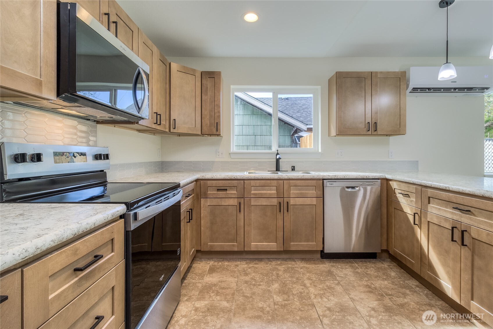506 Edith Avenue Walla Walla, WA 99362 - Photo 3 of 18 a kitchen with granite countertop a sink a stove and cabinets