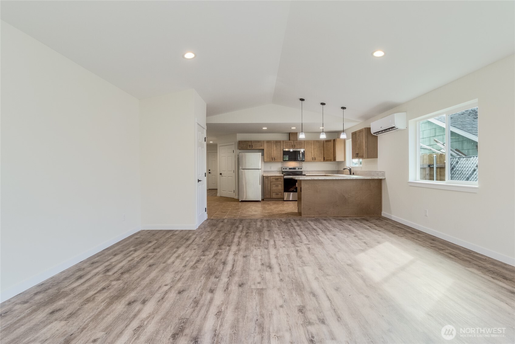 506 Edith Avenue Walla Walla, WA 99362 - Photo 4 of 18 a view of kitchen with wooden floor electronic appliances and window