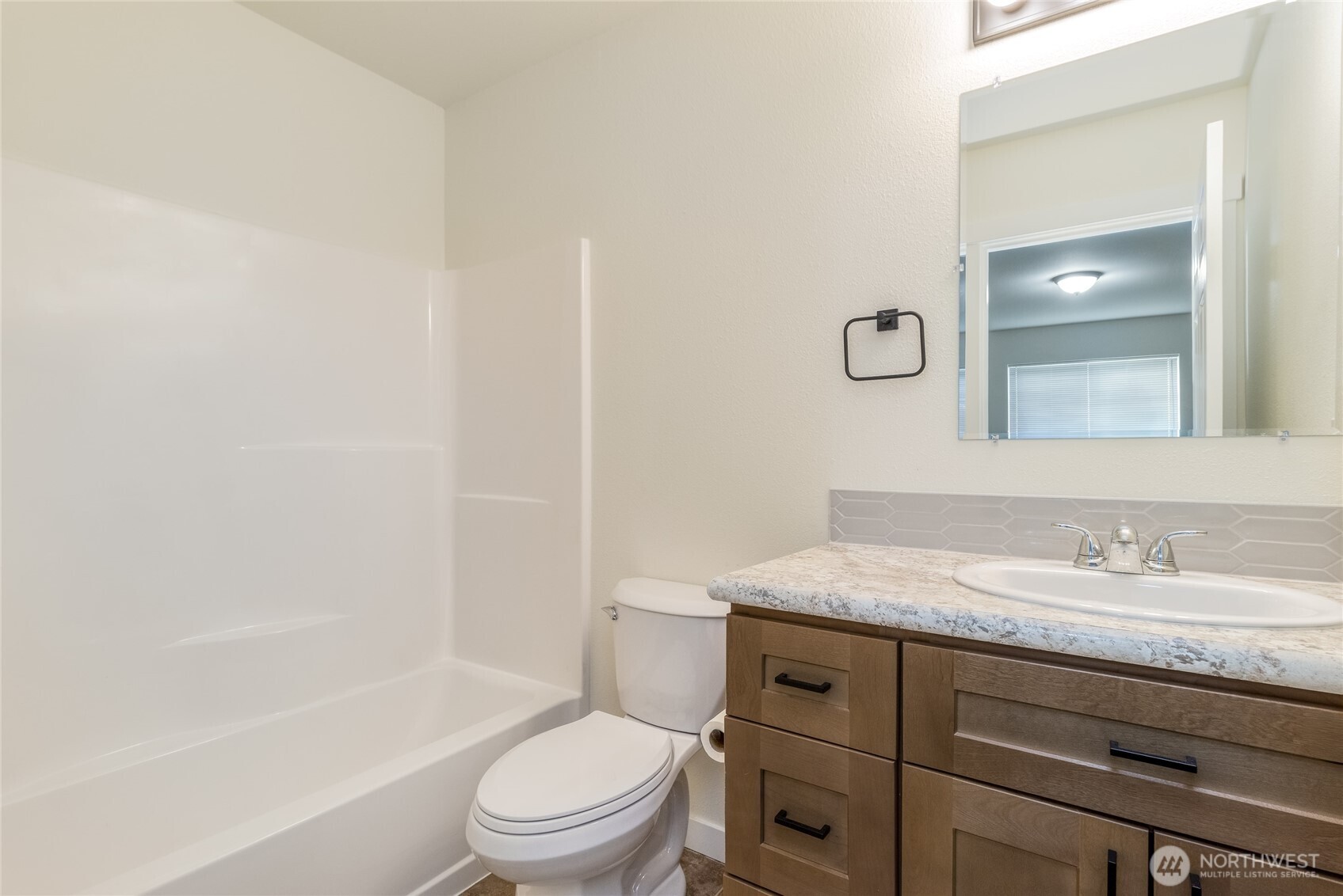 506 Edith Avenue Walla Walla, WA 99362 - Photo 9 of 18 a bathroom with a granite countertop sink toilet and shower