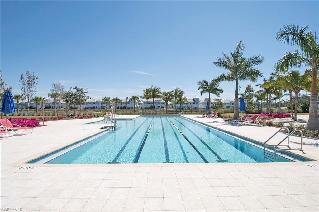 8829 Paradera Court Naples, FL 34112 - Photo 28 of 31 a view of swimming pool with a lounge chair