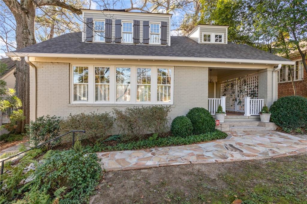 Welcome home to this charming historic Ansley Park Cottage with Country Club Golf Course Setting.  