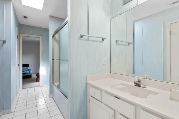 a bathroom with a sink and a mirror