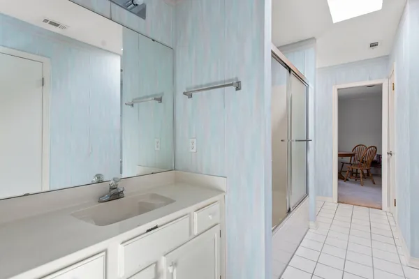 a bathroom with a sink and a mirror