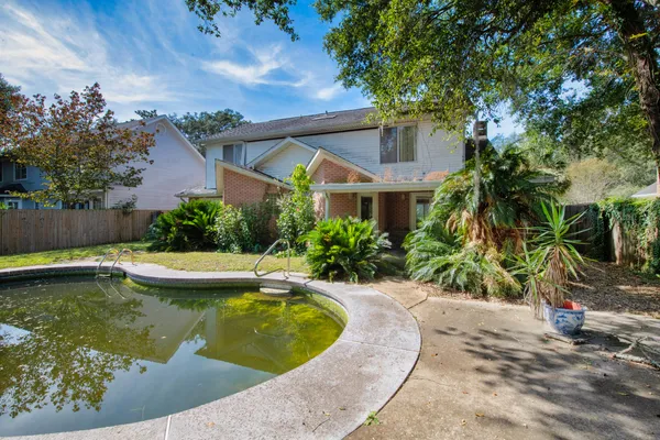 a view of a swimming pool with a patio