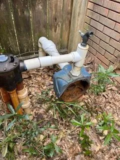 a close up of a toilet in a backyard