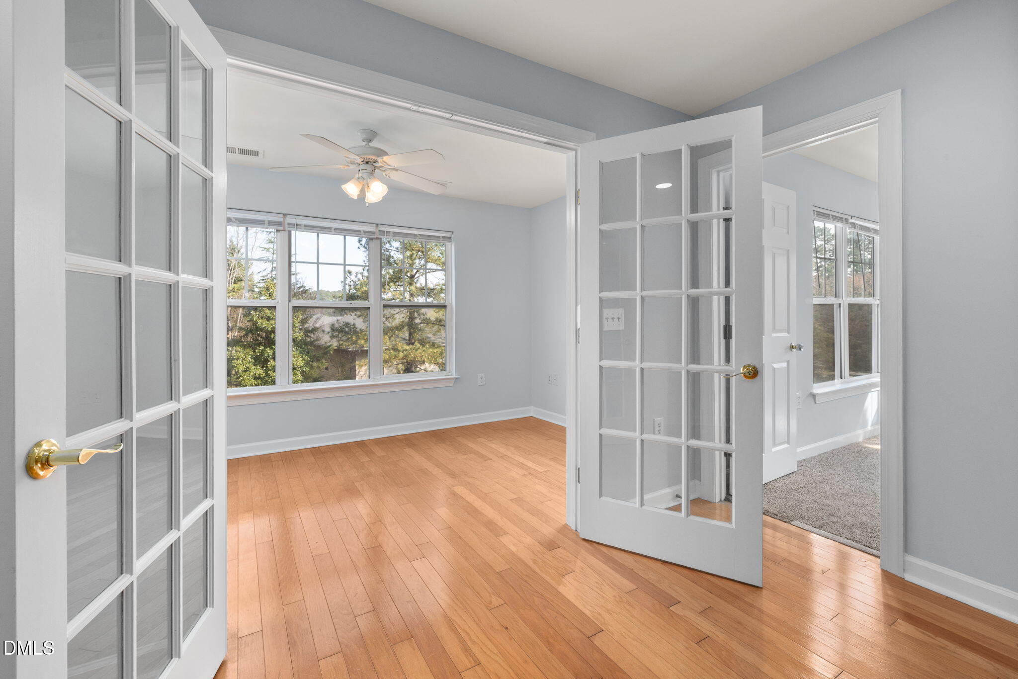 929 Morreene Road, Unit C23 Durham, NC 27705 - Photo 13 of 33 an empty room with wooden floor and windows