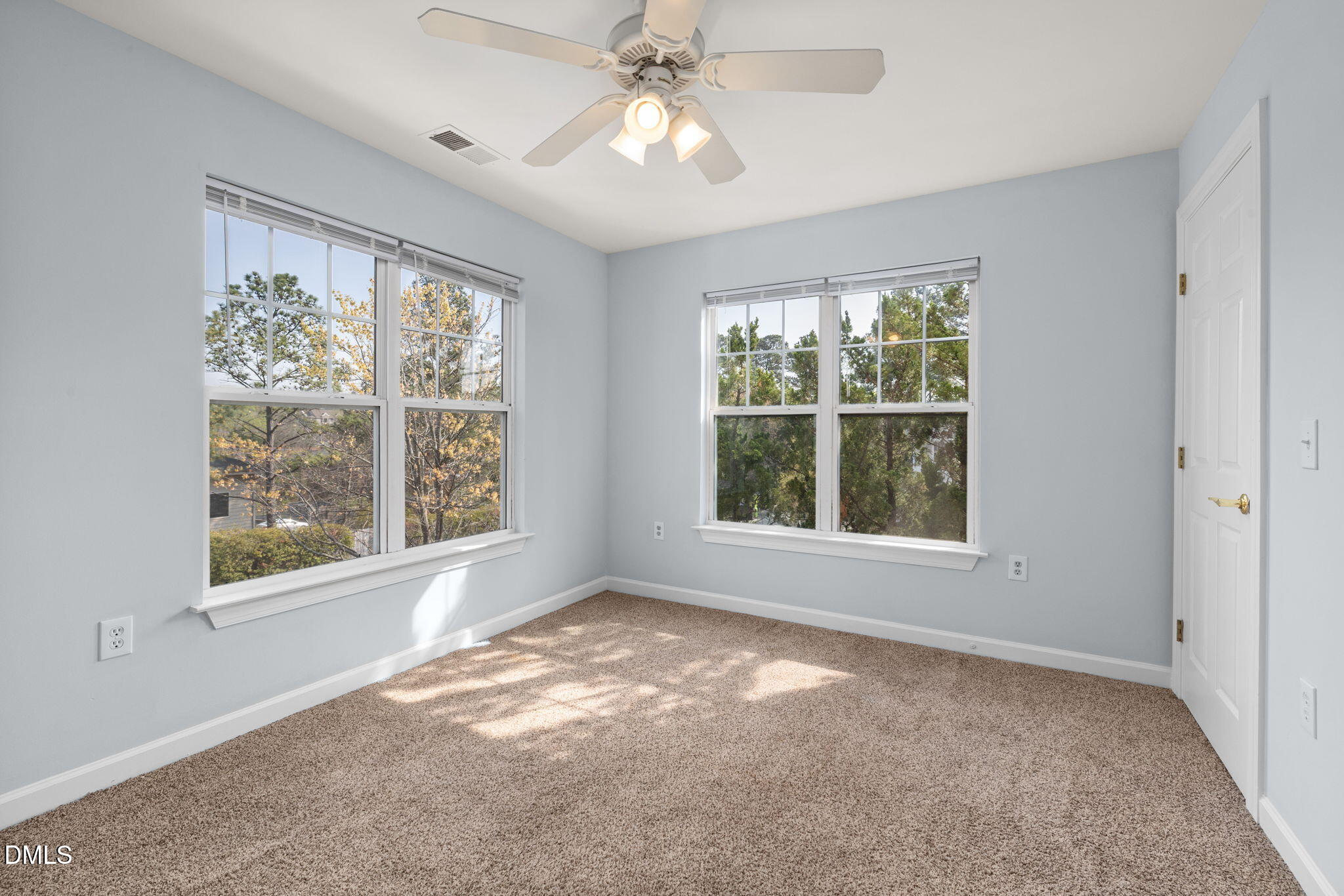 929 Morreene Road, Unit C23 Durham, NC 27705 - Photo 24 of 33 an empty room with a window and ceiling fan