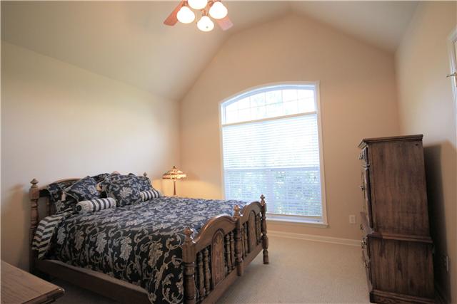1137 Rip Steele Road Columbia, TN 38401 - Photo 12 of 20 High ceilings prove lots of natural lights into this bedroom with ceiling fan/light and large closet.