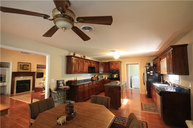 1137 Rip Steele Road Columbia, TN 38401 - Photo 4 of 20 Room for many cooks in this kitchen! Lots of counter space and plenty of cabinets abound in this spacious kitchen with Island. Even an the oven that you don't have to kneel down to peek inside at your goodies!!