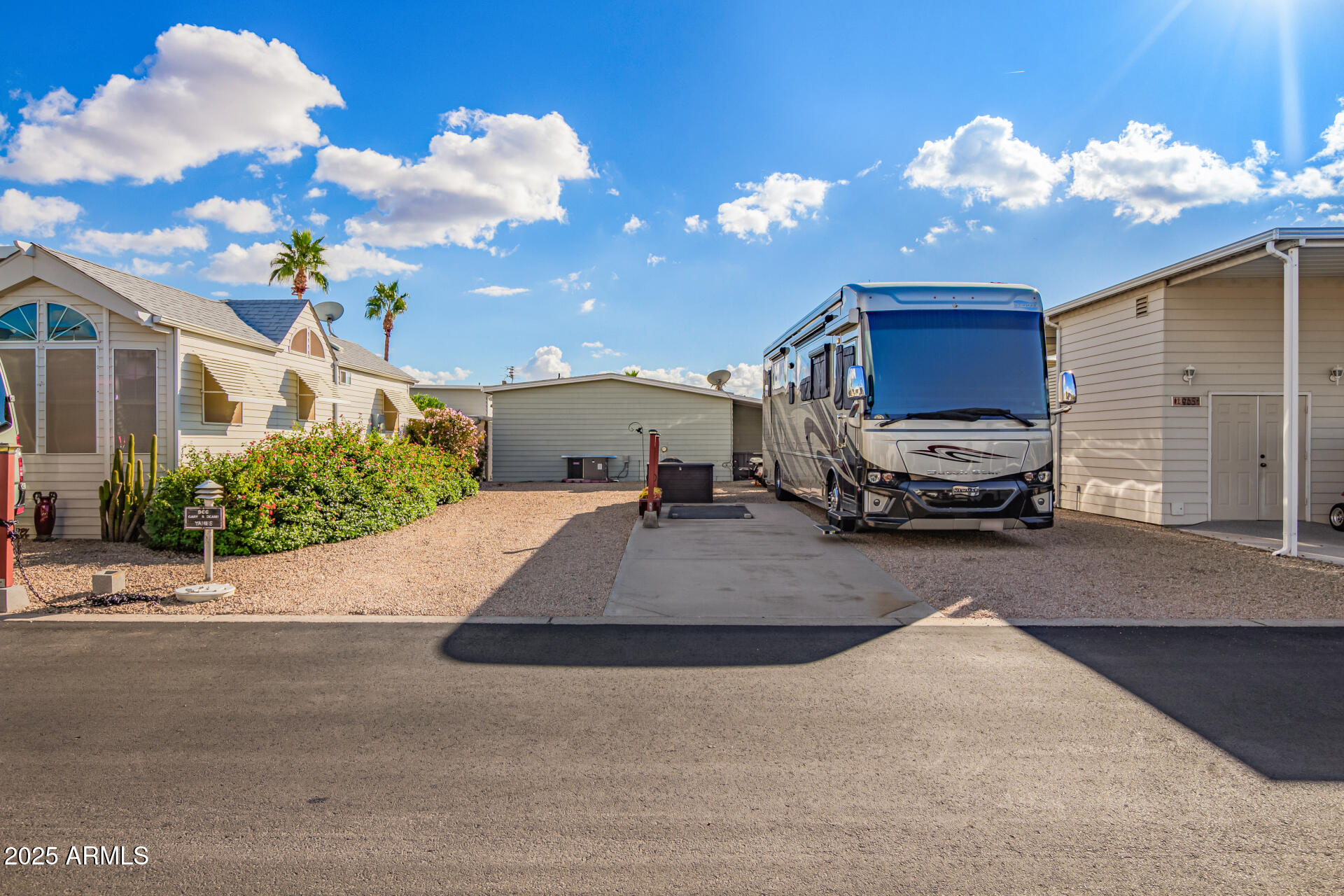 17200 West Bell Road, Unit 966 Surprise, AZ 85374 - Photo 4 of 21 a view of a house with a cars park on the road
