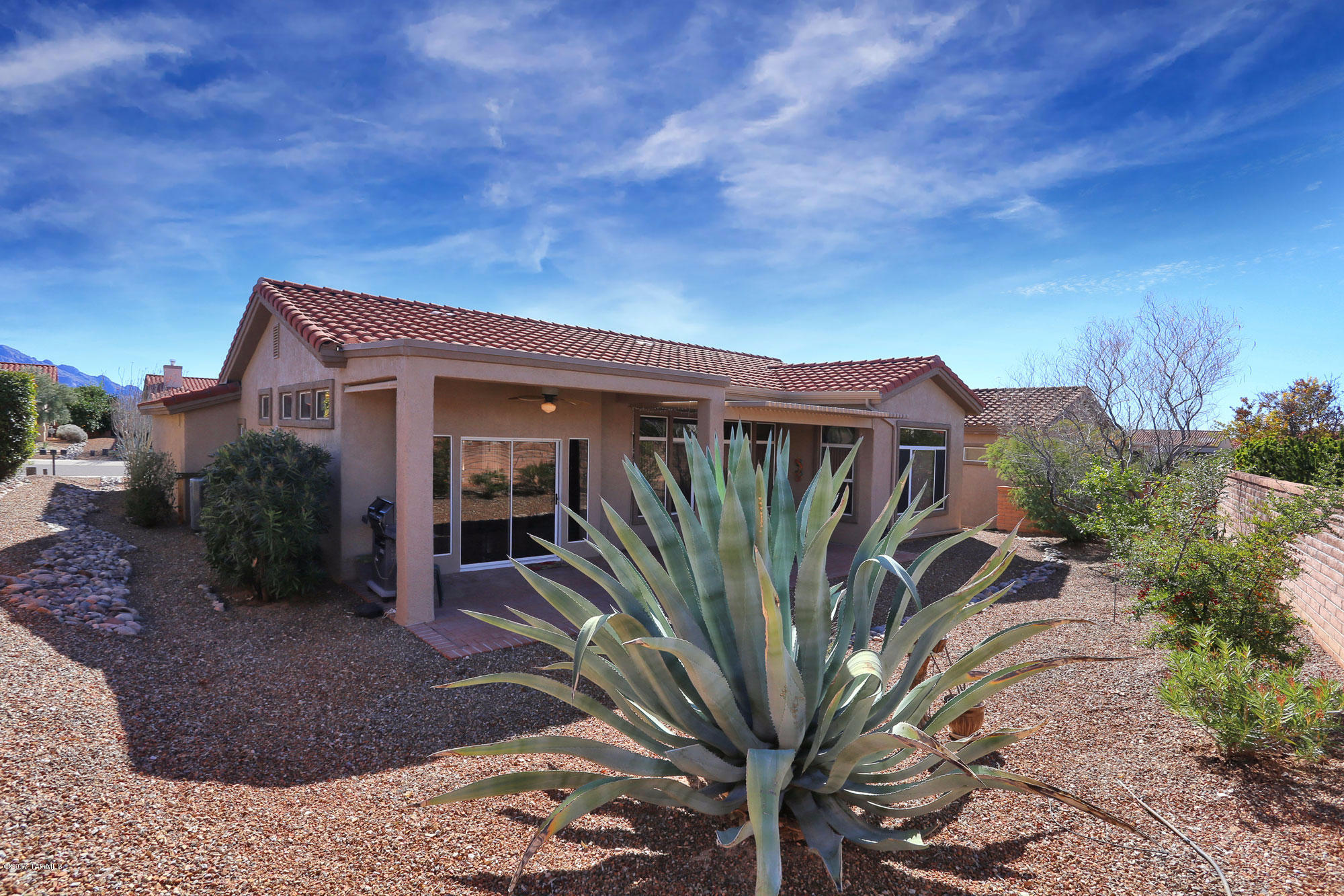 1065 East Royal Oak Road Oro Valley, AZ 85755 - Photo 18 of 19 a view of a house with a garden