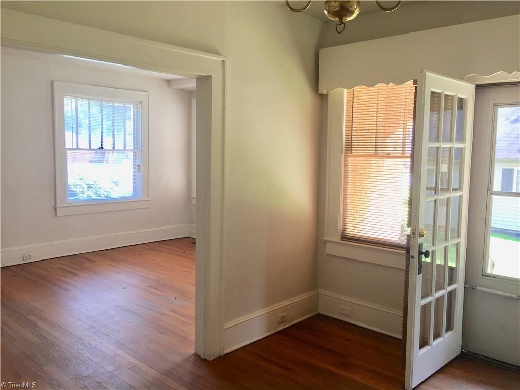 811 Old Winston Road High Point, NC 27265 - Photo 8 of 13 In dining room looking into living room. Hardwoods throughout