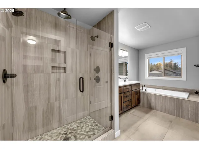 a room with walk in closet and wooden floor