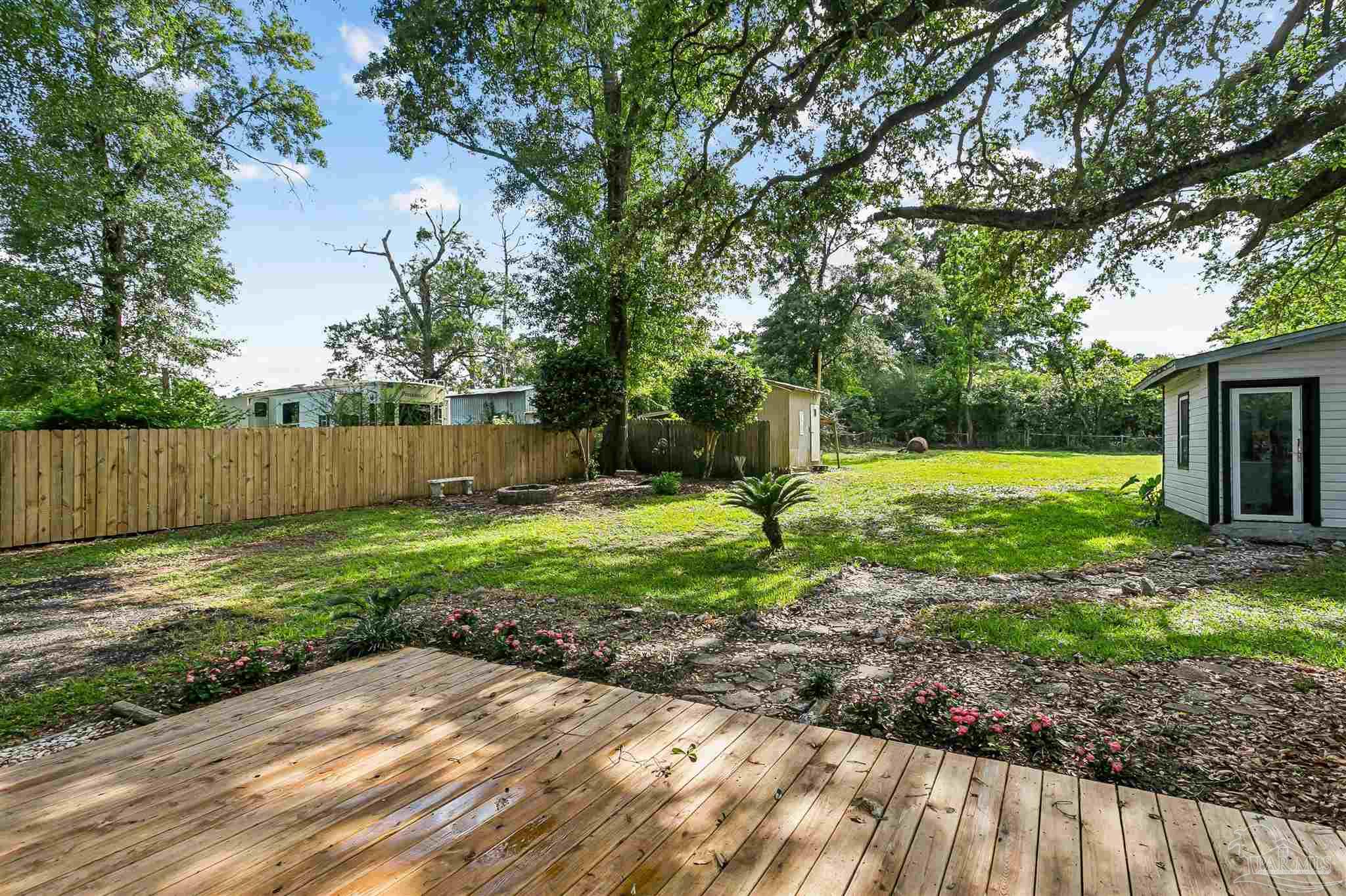 1095 River Annex Road Cantonment, FL 32533 - Photo 29 of 32 a view of a backyard with tree s