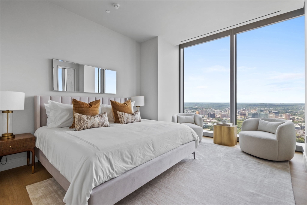 1 Dalton Street, Unit 5101 Boston, MA 02115 - Photo 13 of 31 a bedroom with bed and a large window