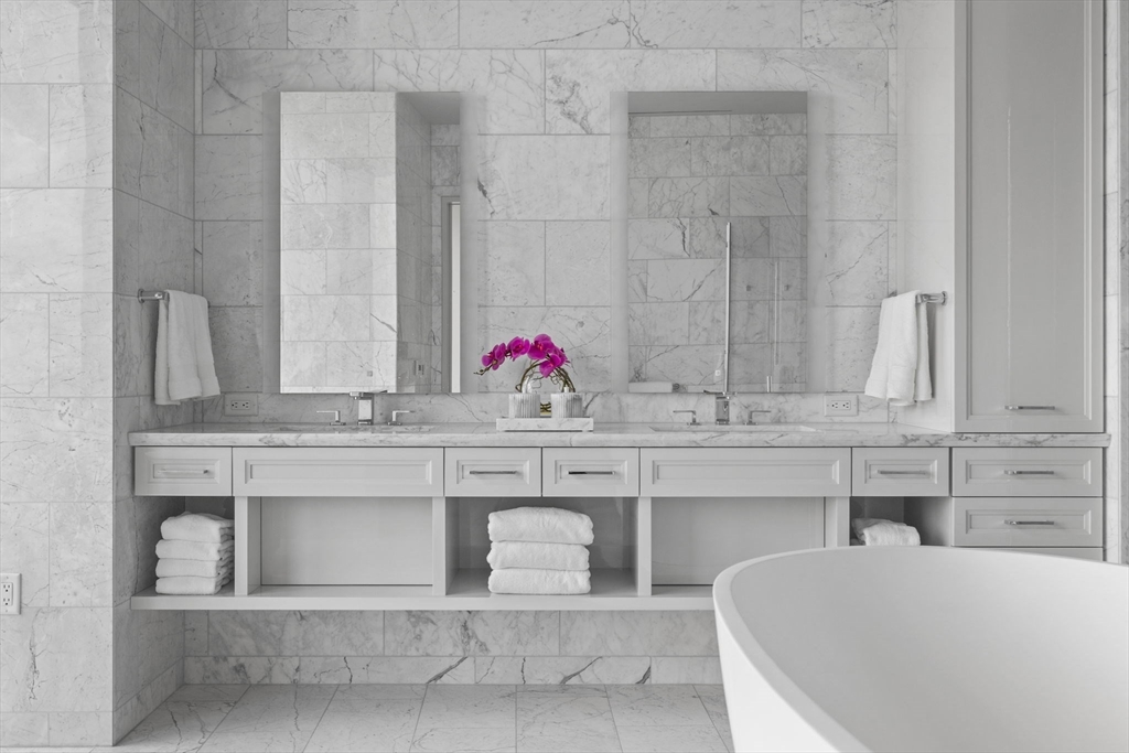 1 Dalton Street, Unit 5101 Boston, MA 02115 - Photo 14 of 31 a bathroom with a sink and a mirror