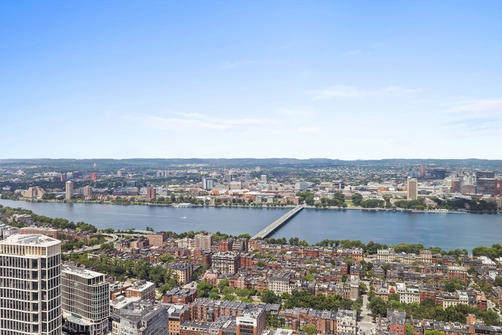 1 Dalton Street, Unit 5101 Boston, MA 02115 - Photo 18 of 31 a view of a lake with tall building in the back