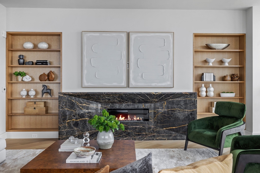 1 Dalton Street, Unit 5101 Boston, MA 02115 - Photo 2 of 31 a living room with furniture and a fireplace