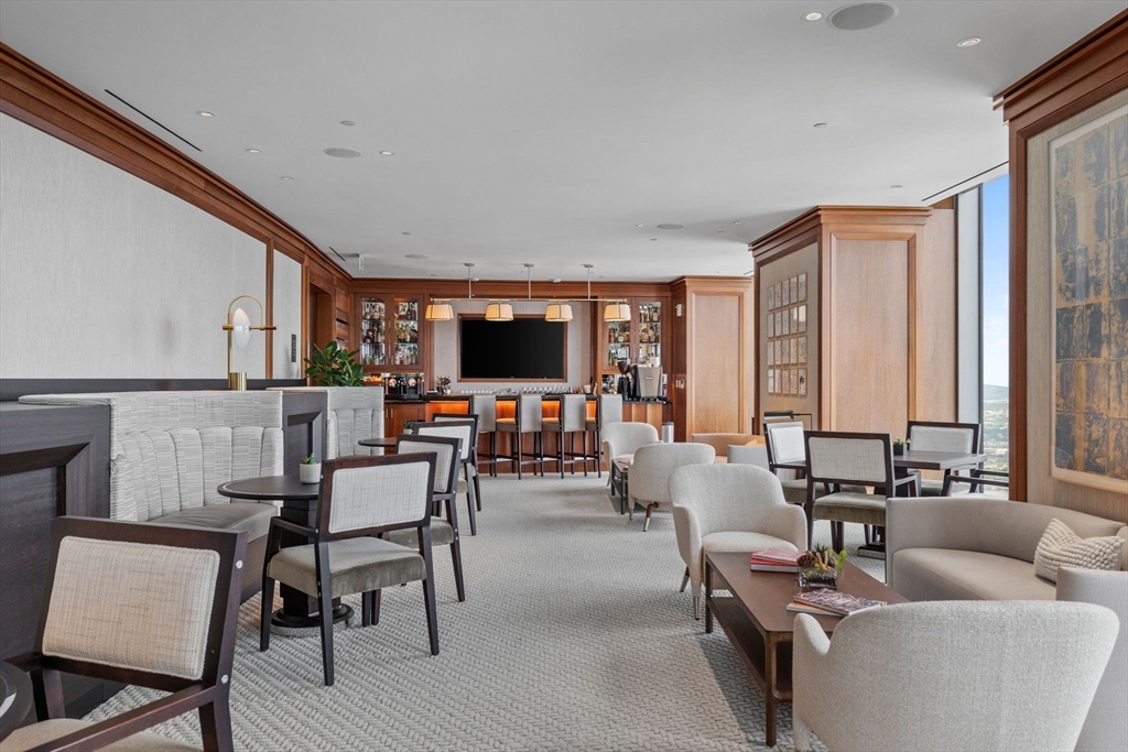 1 Dalton Street, Unit 5101 Boston, MA 02115 - Photo 21 of 31 a living room with furniture and a flat screen tv