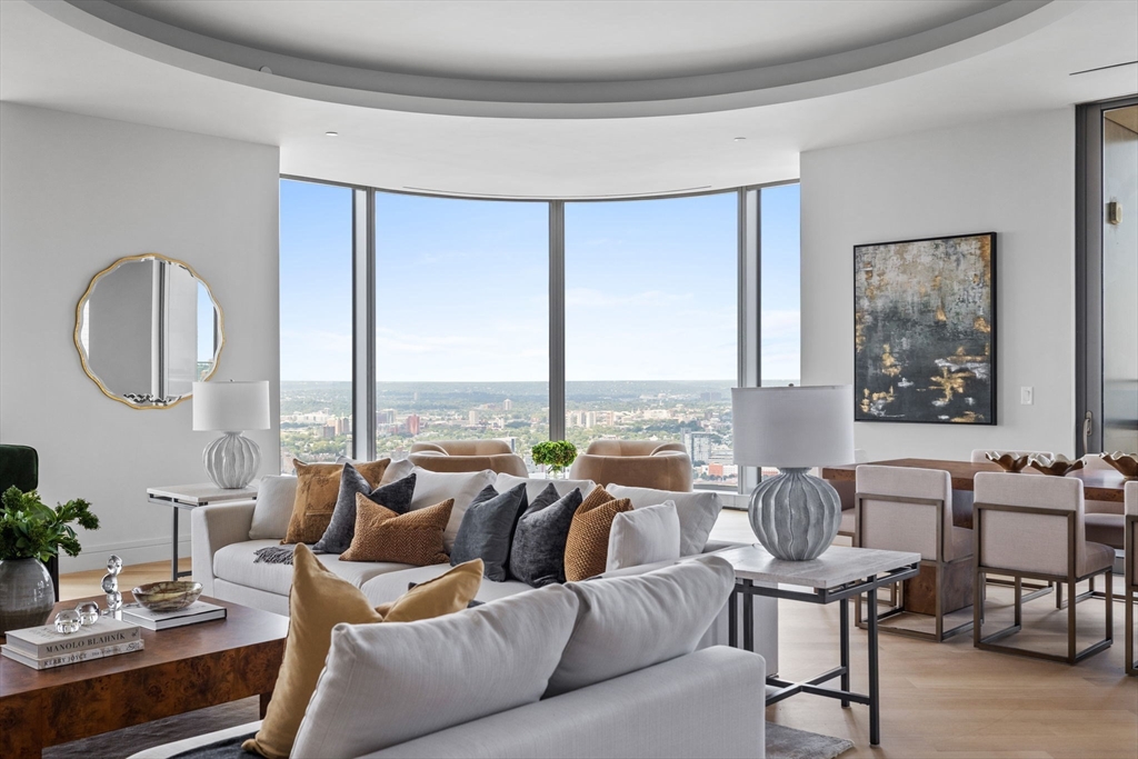 1 Dalton Street, Unit 5101 Boston, MA 02115 - Photo 3 of 31 a living room with furniture and a large window