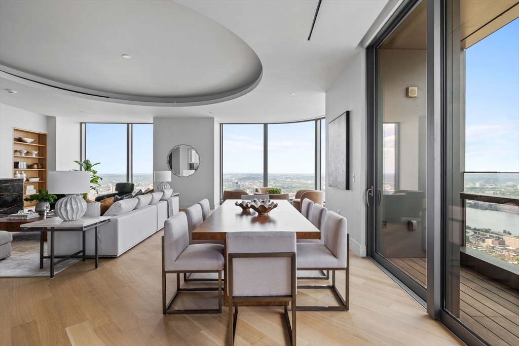 1 Dalton Street, Unit 5101 Boston, MA 02115 - Photo 4 of 31 a room with a table chairs and a large window