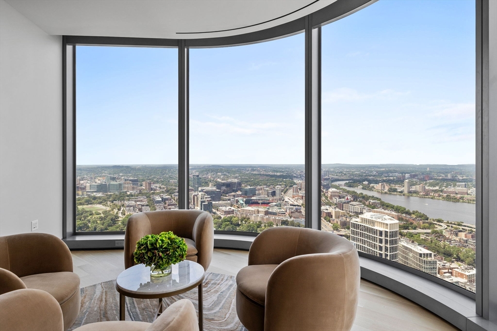 1 Dalton Street, Unit 5101 Boston, MA 02115 - Photo 6 of 31 a view of a living room filled with furniture and a floor to ceiling window