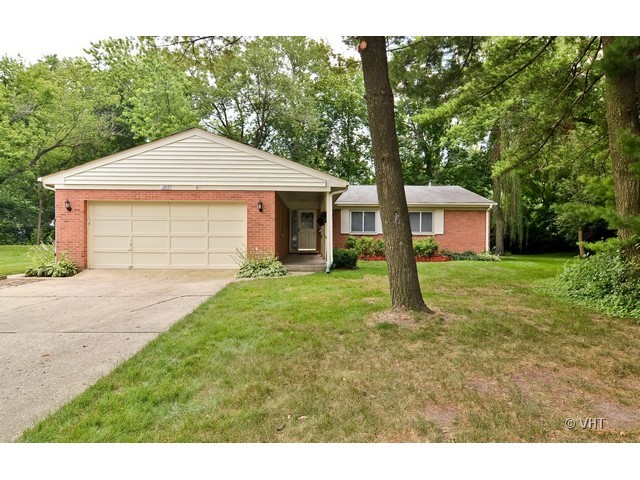 1205 Arbor Vitae Road Deerfield, IL 60015 - Photo 1 of 10 a front view of a house with a yard