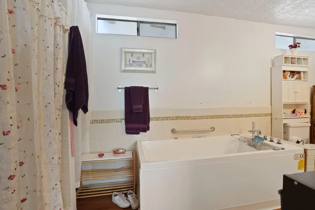 a bathroom with a bathtub and sink