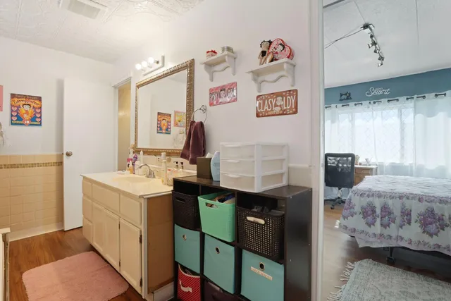 a bathroom with a sink and a mirror