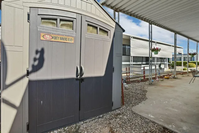 a view of a walk in front of building