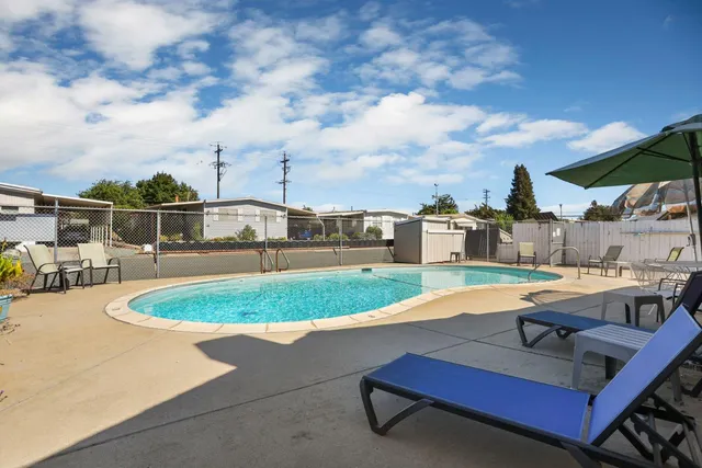 a view of a swimming pool with a patio