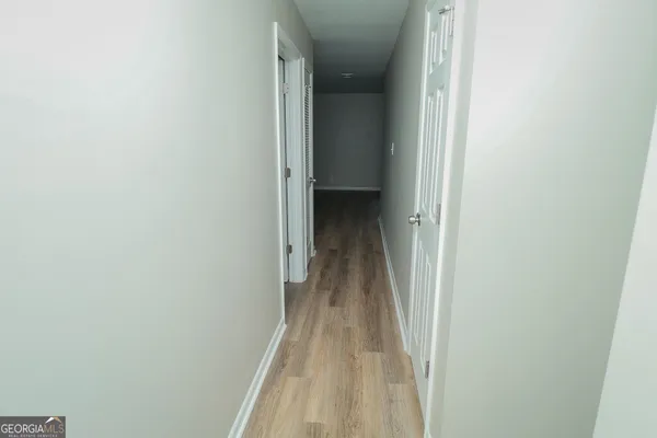 an empty room with a wooden floor