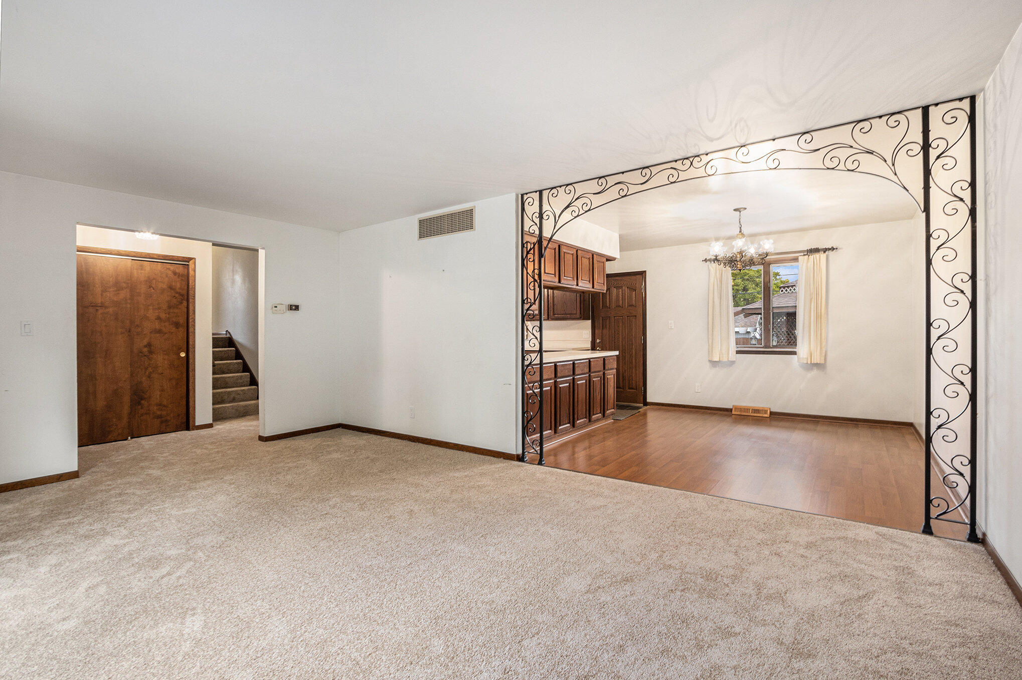 7905 Frederick Avenue Munster, IN 46321 - Photo 12 of 26 a view of a big room with windows and chandelier