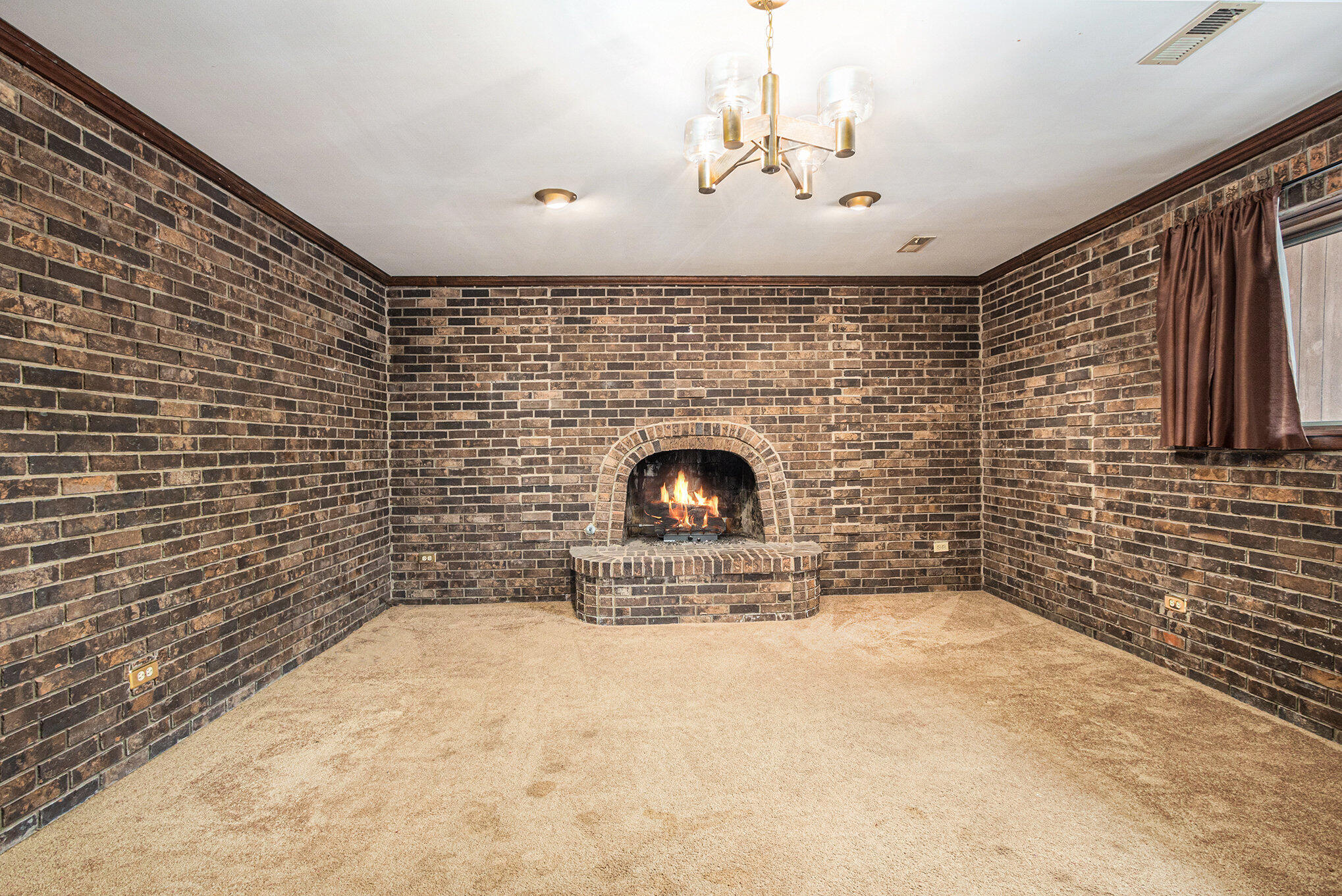 7905 Frederick Avenue Munster, IN 46321 - Photo 18 of 26 a view of empty room with fireplace