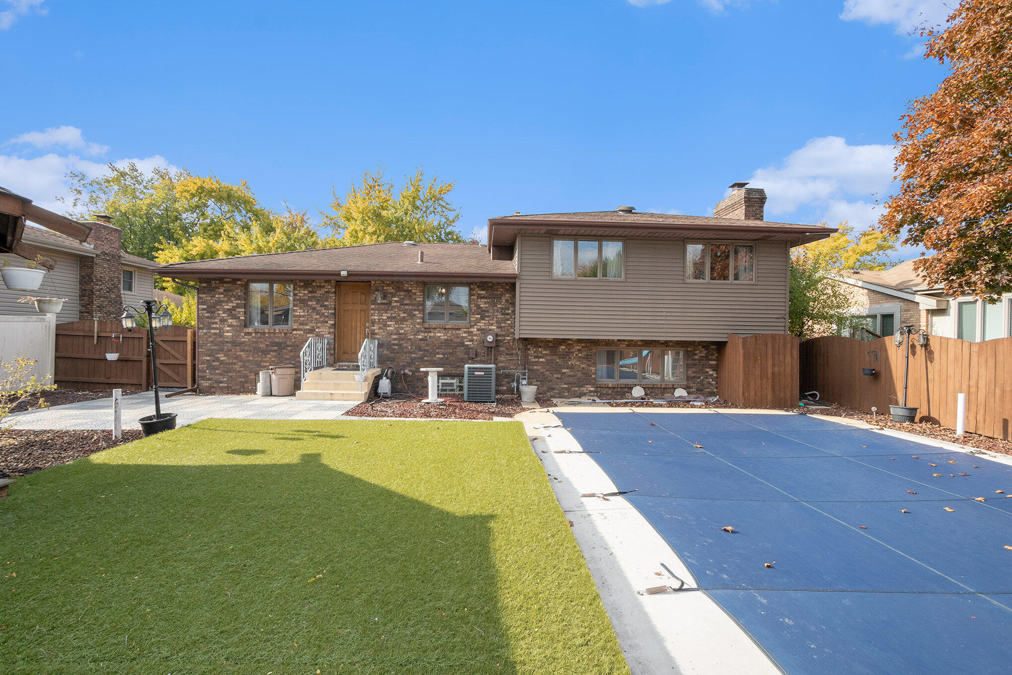 7905 Frederick Avenue Munster, IN 46321 - Photo 2 of 26 a view of a house with swimming pool and sitting area