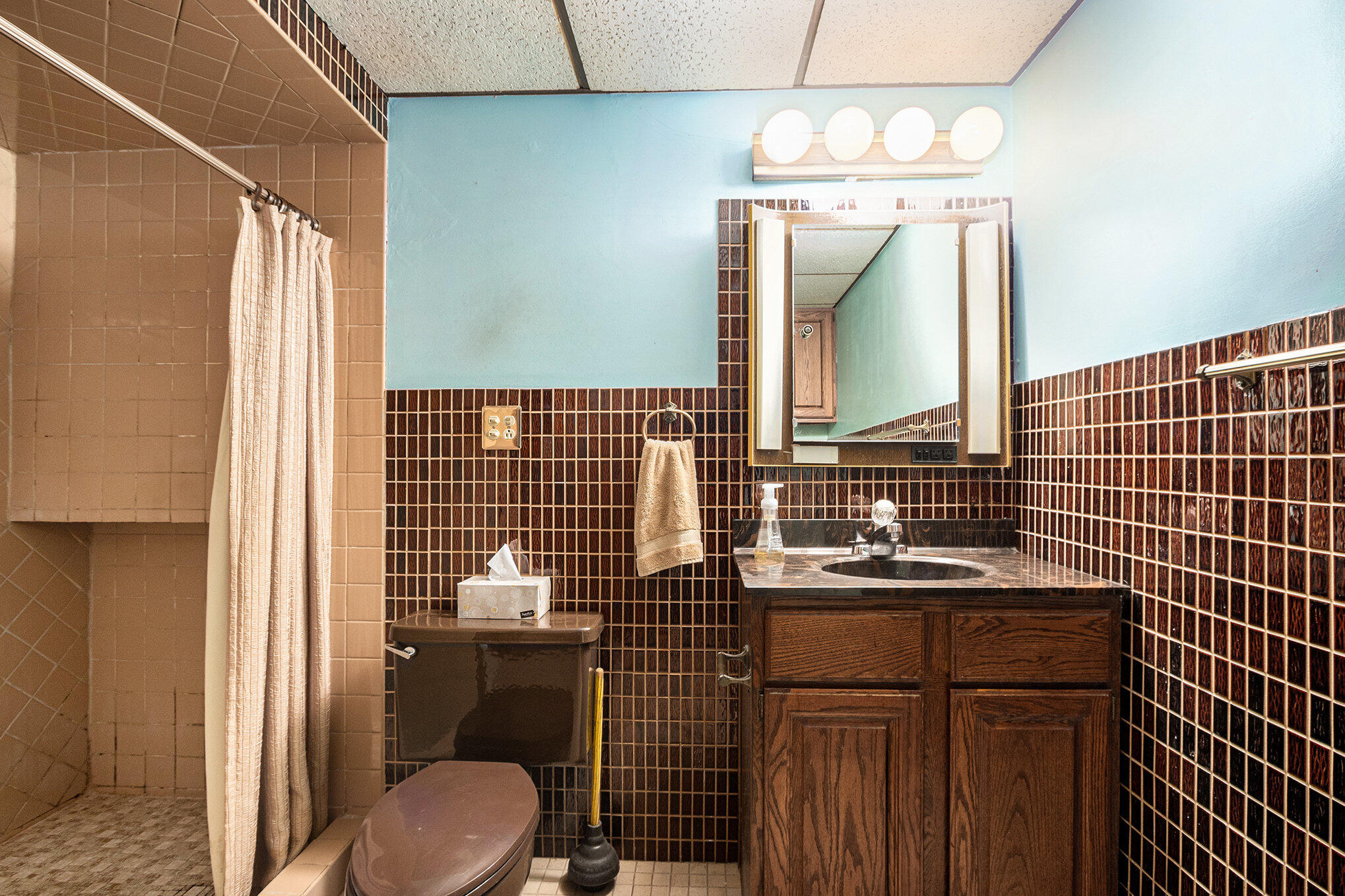 7905 Frederick Avenue Munster, IN 46321 - Photo 21 of 26 a bathroom with a sink a toilet and shower