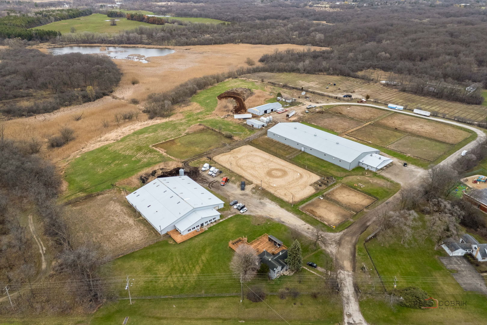 an aerial view of a house with a ocean beach