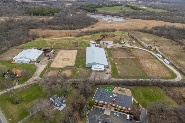 an aerial view of a house with a yard