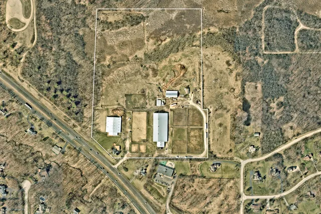 a view of a house with wooden deck and a big yard