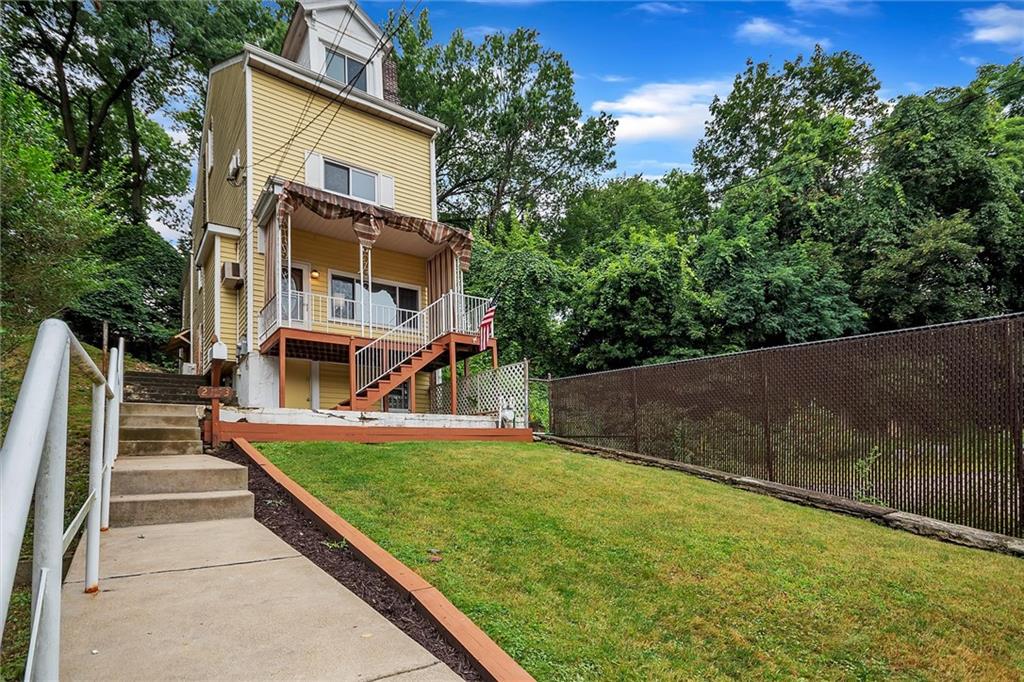 2133 Brighton Road Pittsburgh, PA 15212 - Photo 2 of 23 a view of an house with backyard and trees