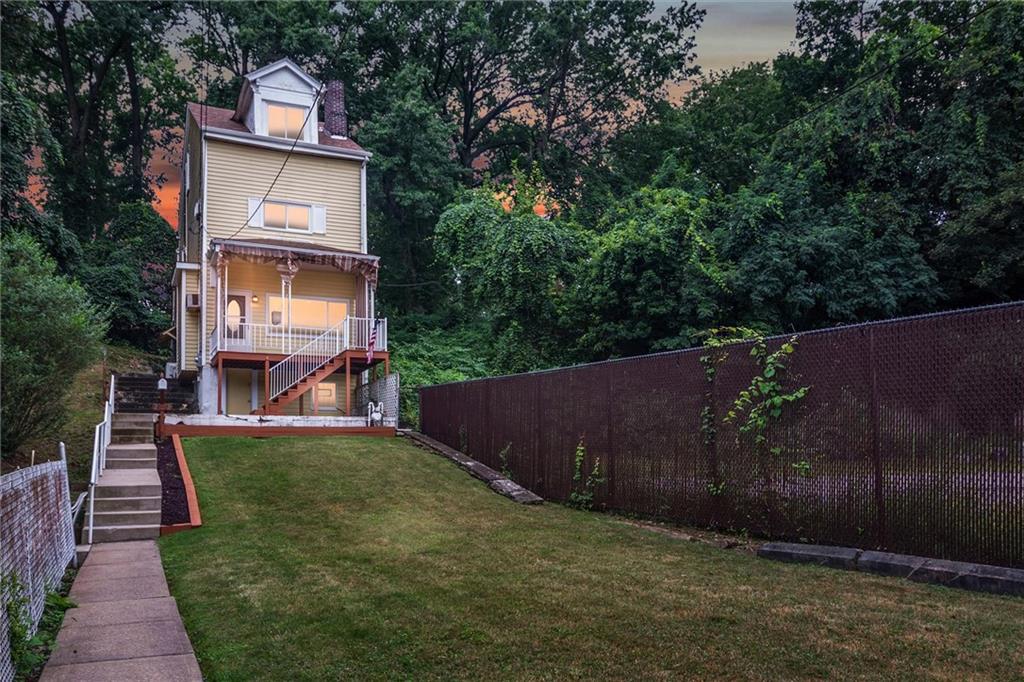 2133 Brighton Road Pittsburgh, PA 15212 - Photo 23 of 23 a backyard of a house with wooden floor and fence
