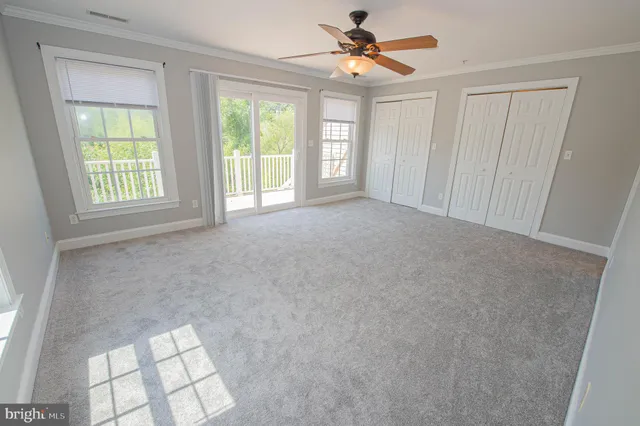 a balcony with wooden floor and fence